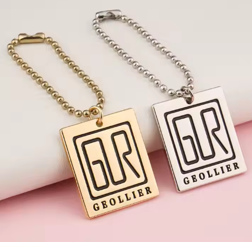 How does the engraved round metal logo detect if the paint is falling off?-A
